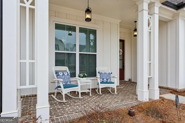 entrance to property featuring covered porch