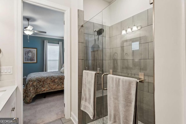 bathroom featuring ceiling fan, vanity, and a shower with shower door