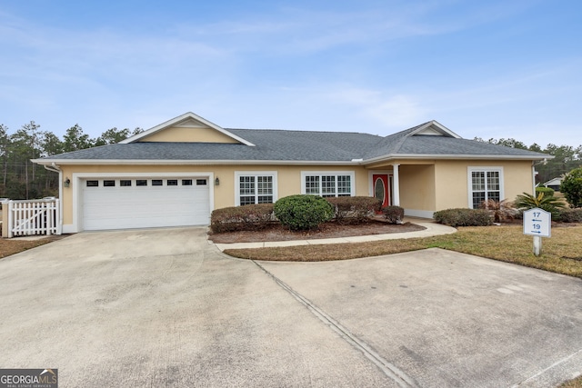 single story home featuring a garage