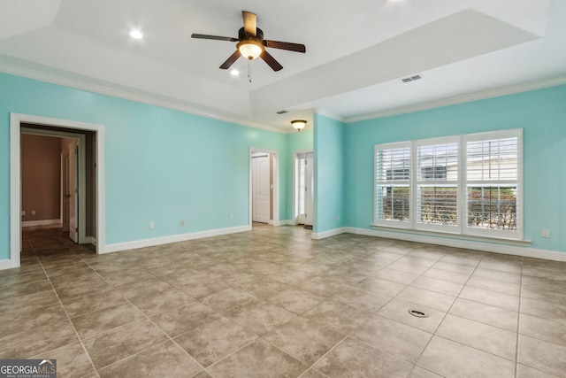 17 Coastal Walk, Saint Marys, GA 31558 - spare room featuring crown molding, light tile patterned floors, ceiling fan, and a tray ceiling