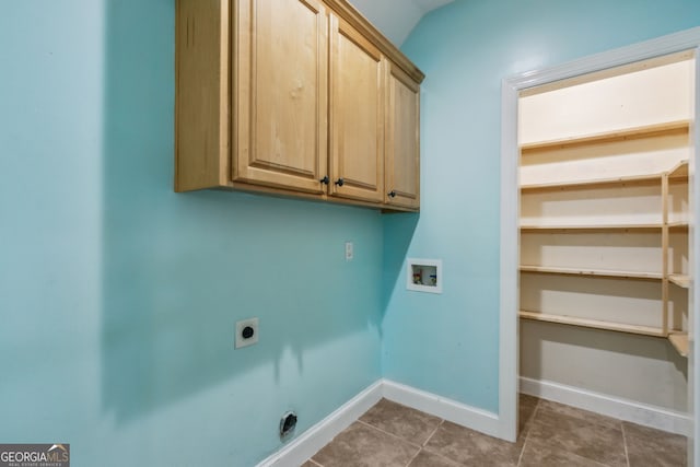 17 Coastal Walk, Saint Marys, GA 31558 - laundry room featuring electric dryer hookup, washer hookup, cabinets, and dark tile patterned flooring