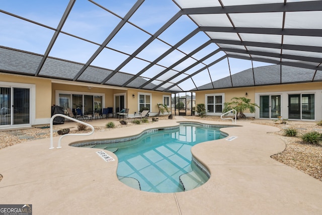 17 Coastal Walk, Saint Marys, GA 31558 - view of swimming pool featuring glass enclosure and a patio area