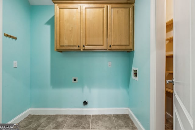 17 Coastal Walk, Saint Marys, GA 31558 - laundry room featuring hookup for a washing machine, electric dryer hookup, tile patterned floors, and cabinets