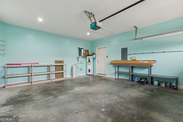 17 Coastal Walk, Saint Marys, GA 31558 - garage featuring water heater, a garage door opener, and electric panel