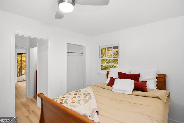 bedroom featuring a closet, ceiling fan, and light hardwood / wood-style flooring