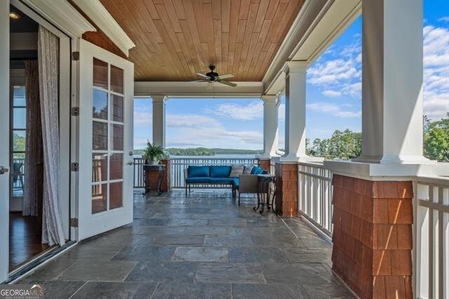 view of patio / terrace featuring french doors and ceiling fan