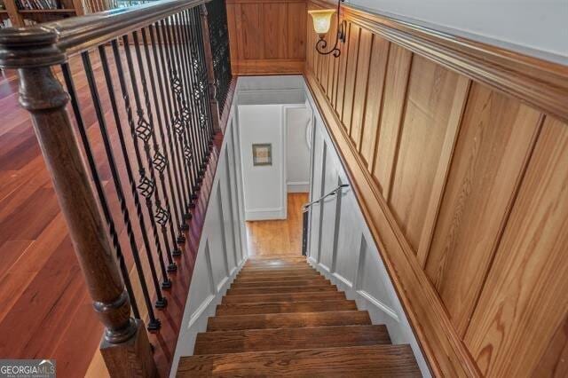 stairs with hardwood / wood-style floors