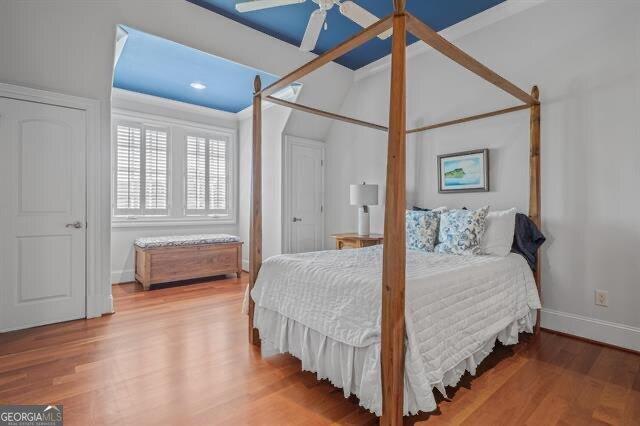 bedroom featuring hardwood / wood-style floors and ceiling fan