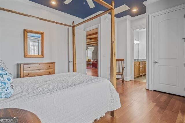 bedroom featuring ceiling fan and hardwood / wood-style floors