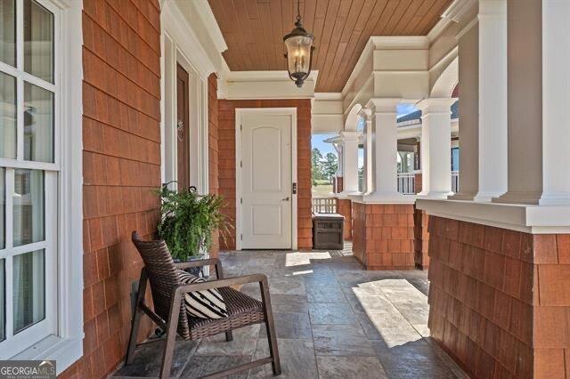 doorway to property featuring a porch