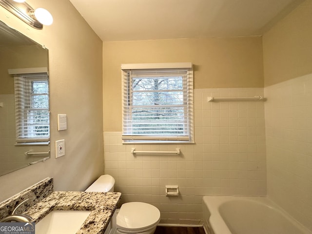 2004 Shamrock Dr, Decatur, GA 30032 - bathroom with tile walls, vanity, healthy amount of natural light, and wainscoting