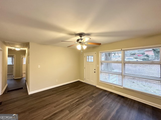 interior space with dark hardwood / wood-style flooring, a wealth of natural light, and ceiling fan