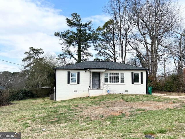 view of front of property with cooling unit and a front lawn