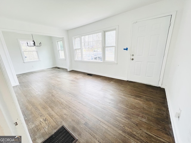 entrance foyer with dark hardwood / wood-style flooring