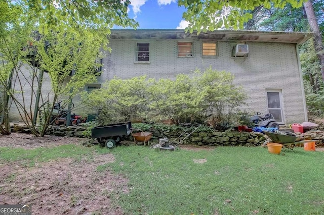 rear view of house with a lawn