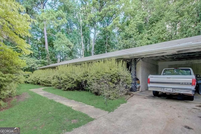 view of side of home with a carport