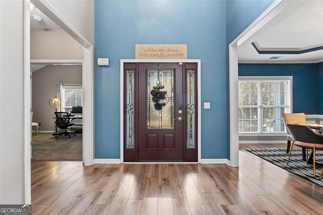 foyer entrance with light hardwood / wood-style flooring