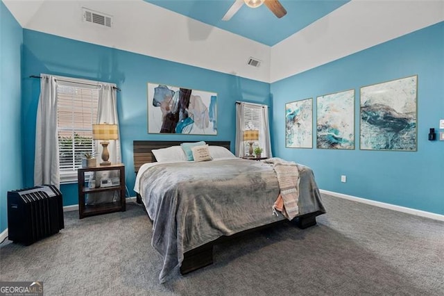 bedroom featuring vaulted ceiling, ceiling fan, and carpet