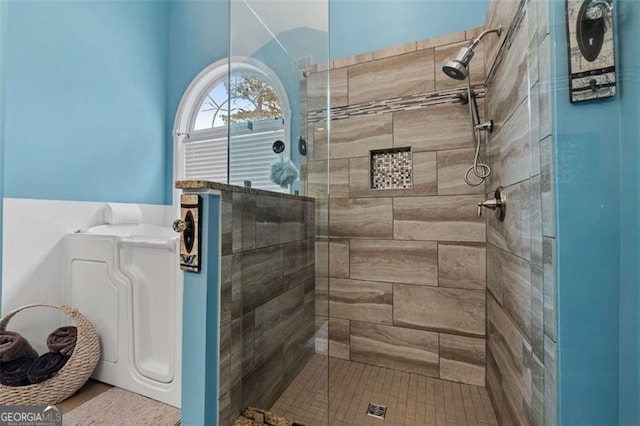 bathroom with a shower with shower door