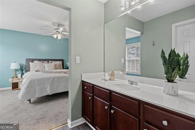 bathroom featuring ceiling fan and vanity