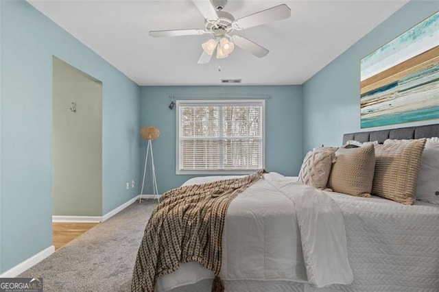 carpeted bedroom with ceiling fan