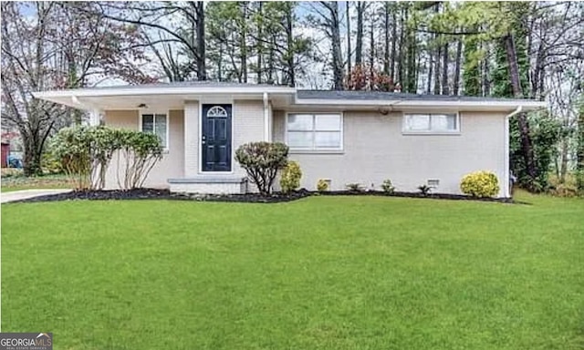 ranch-style house featuring a front lawn