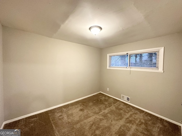 unfurnished room with carpet flooring