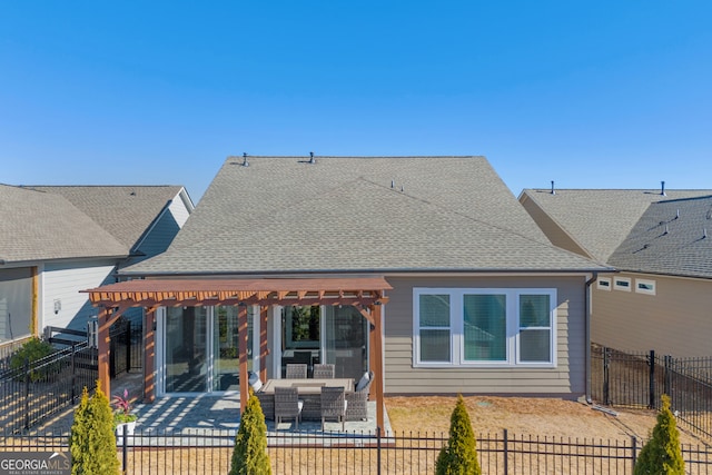 rear view of house with an outdoor hangout area and a patio area