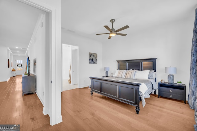 bedroom with ceiling fan and light wood-type flooring