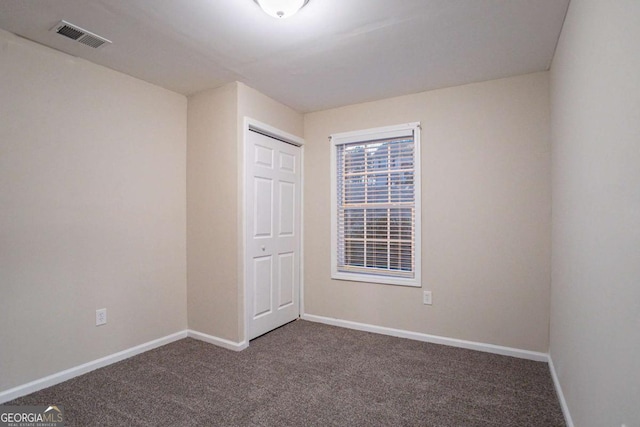 view of carpeted spare room