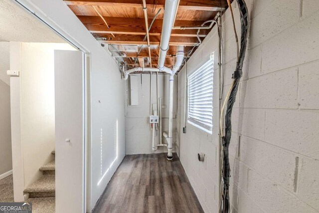 basement with dark wood-type flooring
