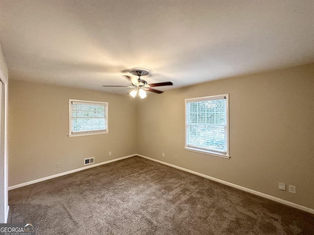 carpeted empty room with ceiling fan