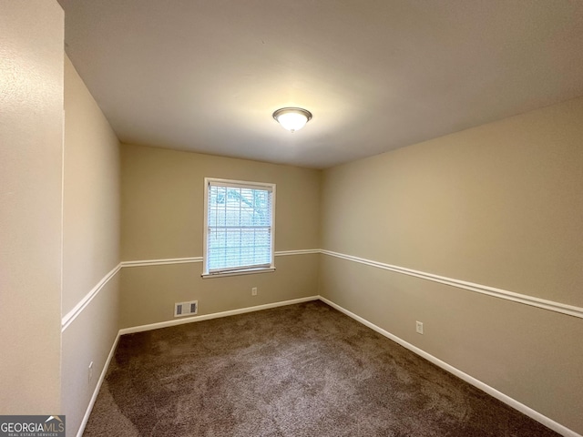 unfurnished room with carpet flooring