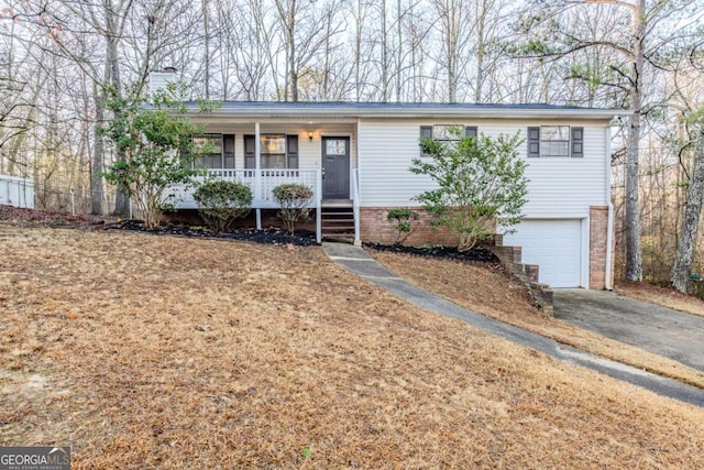 ranch-style home with a garage and a porch