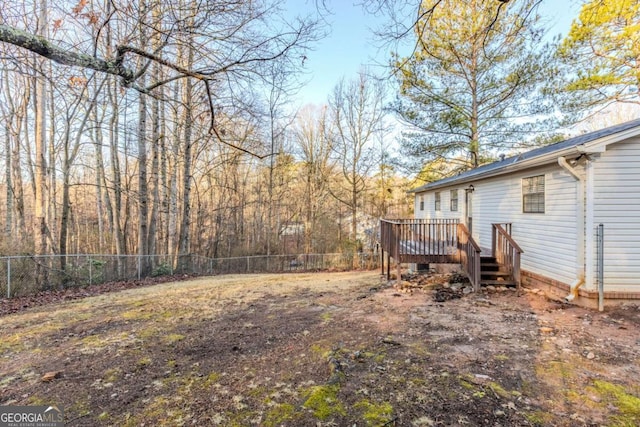 view of yard with a wooden deck