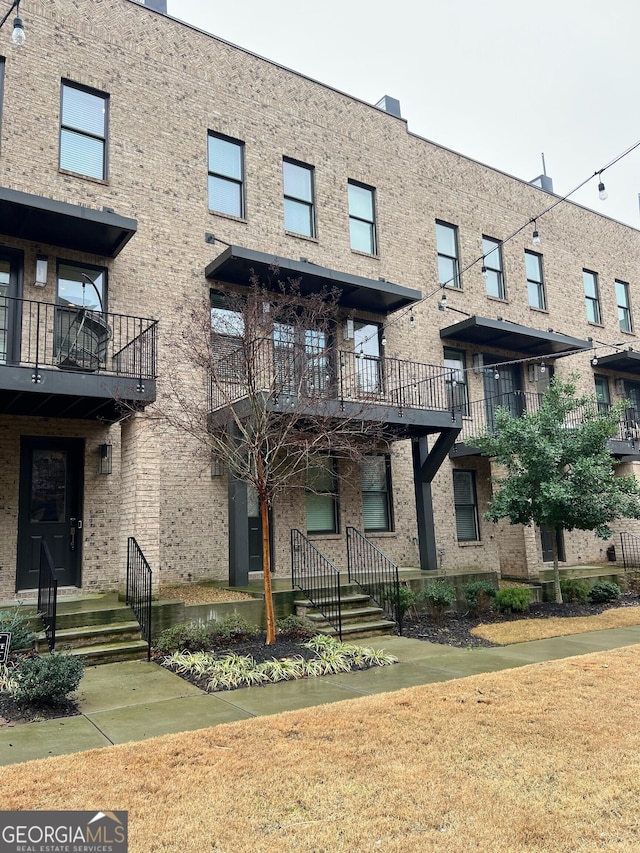 view of front of home featuring brick siding