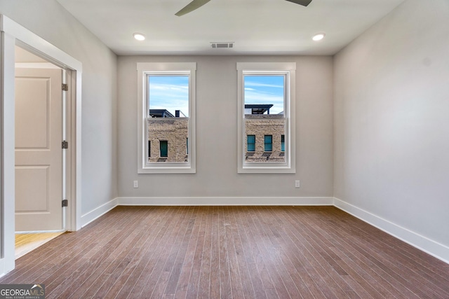 1028 Robert Smalls Way, Atlanta, GA 30318 - spare room with visible vents, baseboards, a ceiling fan, and hardwood / wood-style floors
