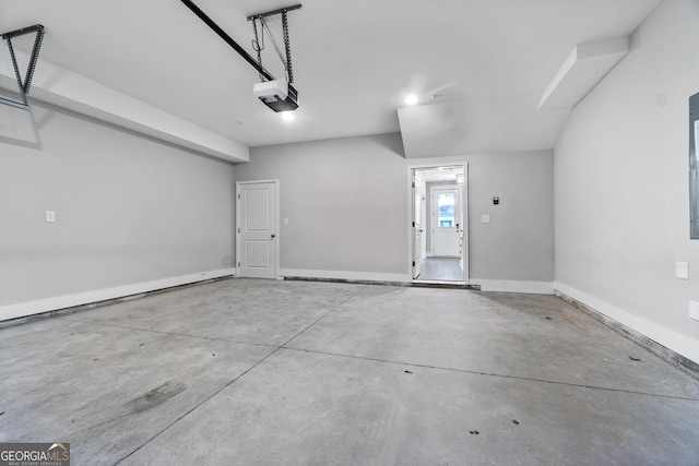 garage with baseboards and a garage door opener