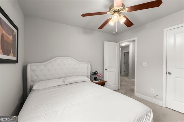 bedroom with ceiling fan and carpet flooring