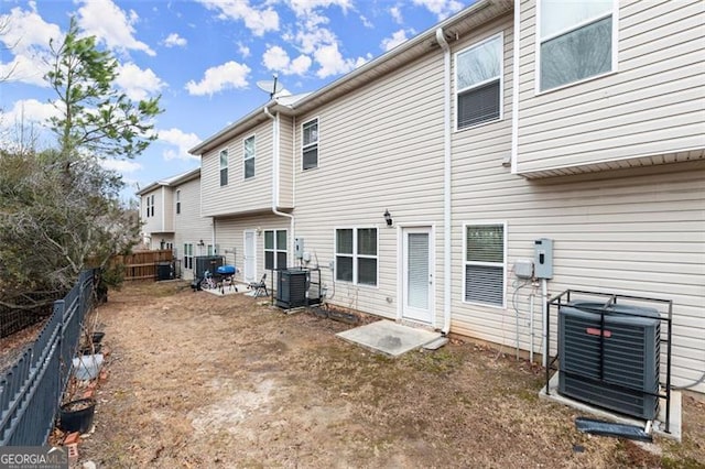 back of property with central AC unit