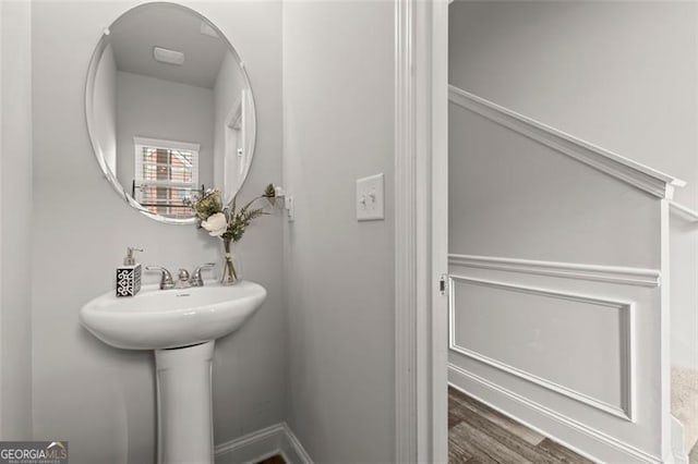 bathroom with hardwood / wood-style flooring