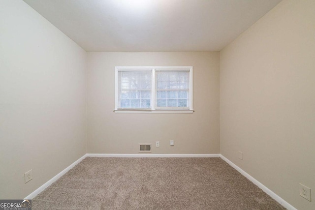 empty room featuring carpet flooring