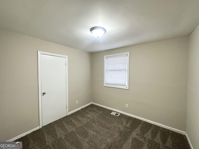 360 Belgarde Pl, Atlanta, GA 30354 - empty room with dark carpet and baseboards