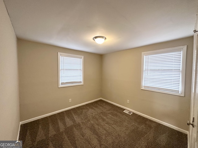 360 Belgarde Pl, Atlanta, GA 30354 - empty room featuring dark carpet and baseboards