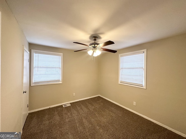 360 Belgarde Pl, Atlanta, GA 30354 - spare room featuring a ceiling fan, healthy amount of natural light, and dark colored carpet