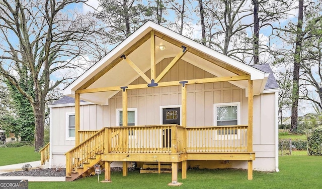 1158 Edgefield Dr SW, Atlanta, GA 30310 - back of property with board and batten siding, a shingled roof, and a lawn