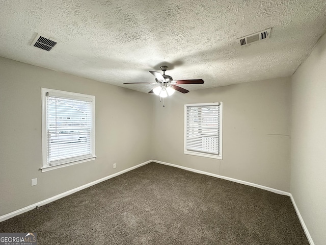 1158 Edgefield Dr SW, Atlanta, GA 30310 - unfurnished room featuring ceiling fan, healthy amount of natural light, dark carpet, and a textured ceiling