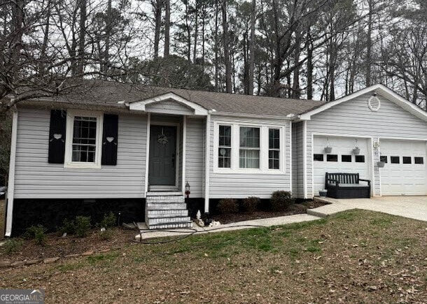 ranch-style home with a garage