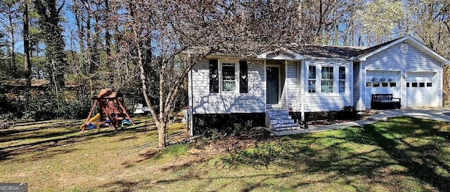 exterior space with a front yard, a playground, an attached garage, and driveway