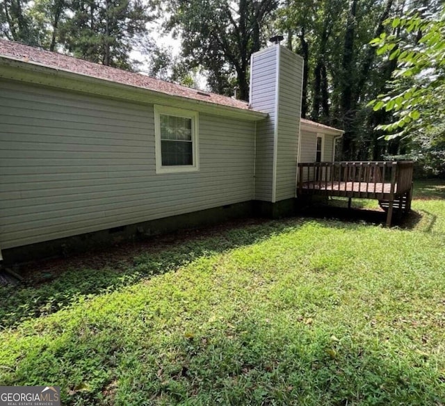 view of yard with a wooden deck